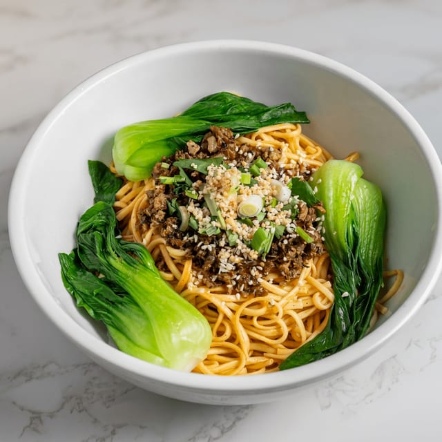 G16. Dan Dan Spicy Noodles.