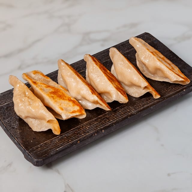 G14. Pan Fried Pork Dumplings.